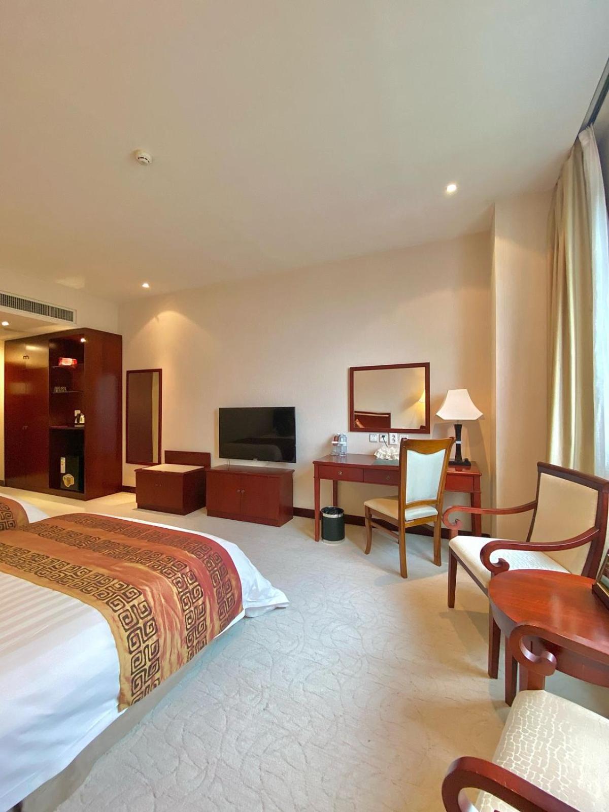 Beijing Palace Soluxe Hotel Astana Exterior foto A room at the hotel